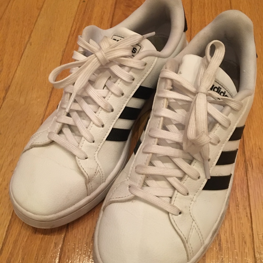 Adidas white with black stripe tennis shoes. Size 8